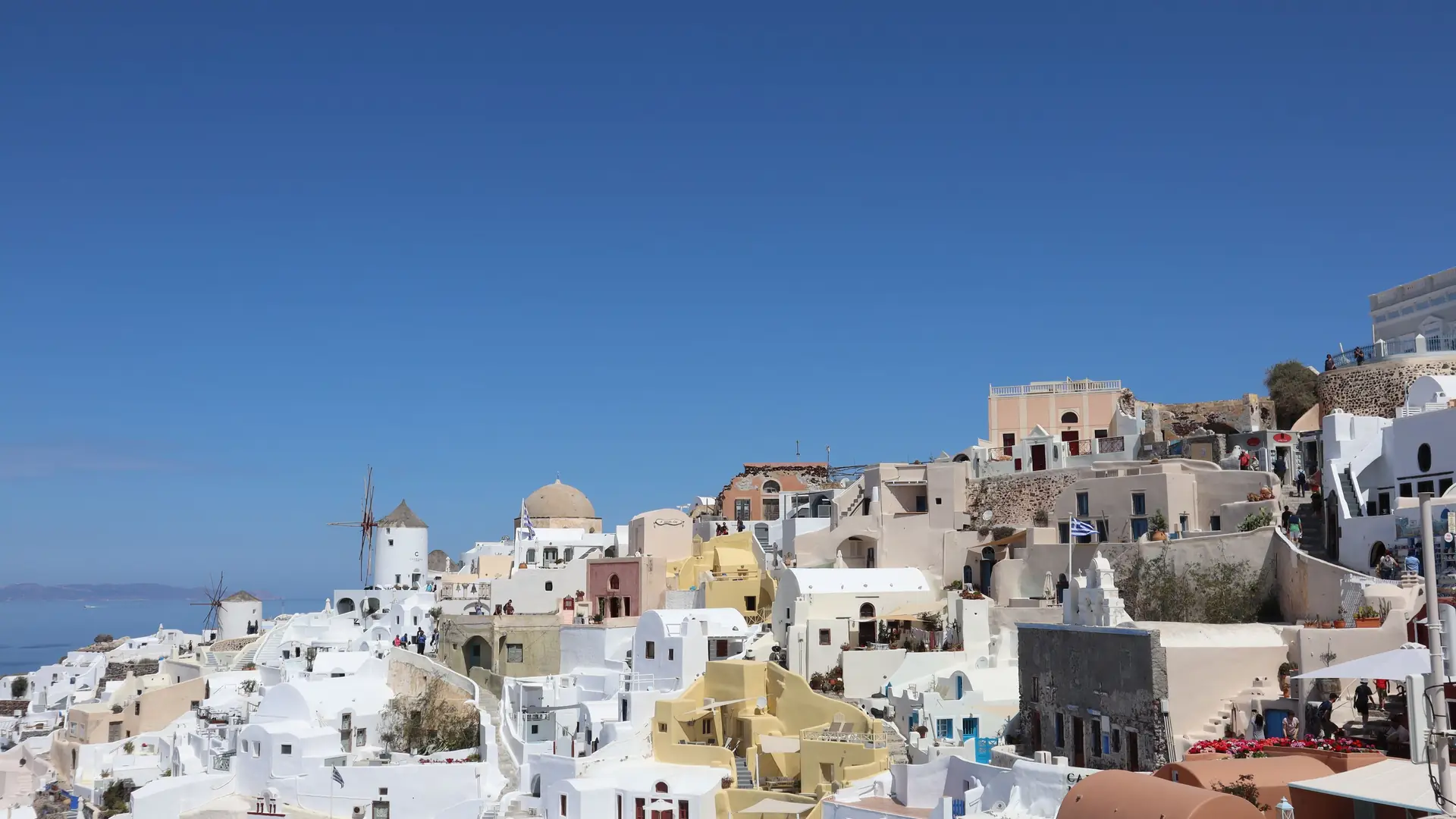 The white village of Oia along the cliff top in Santorini, Greece