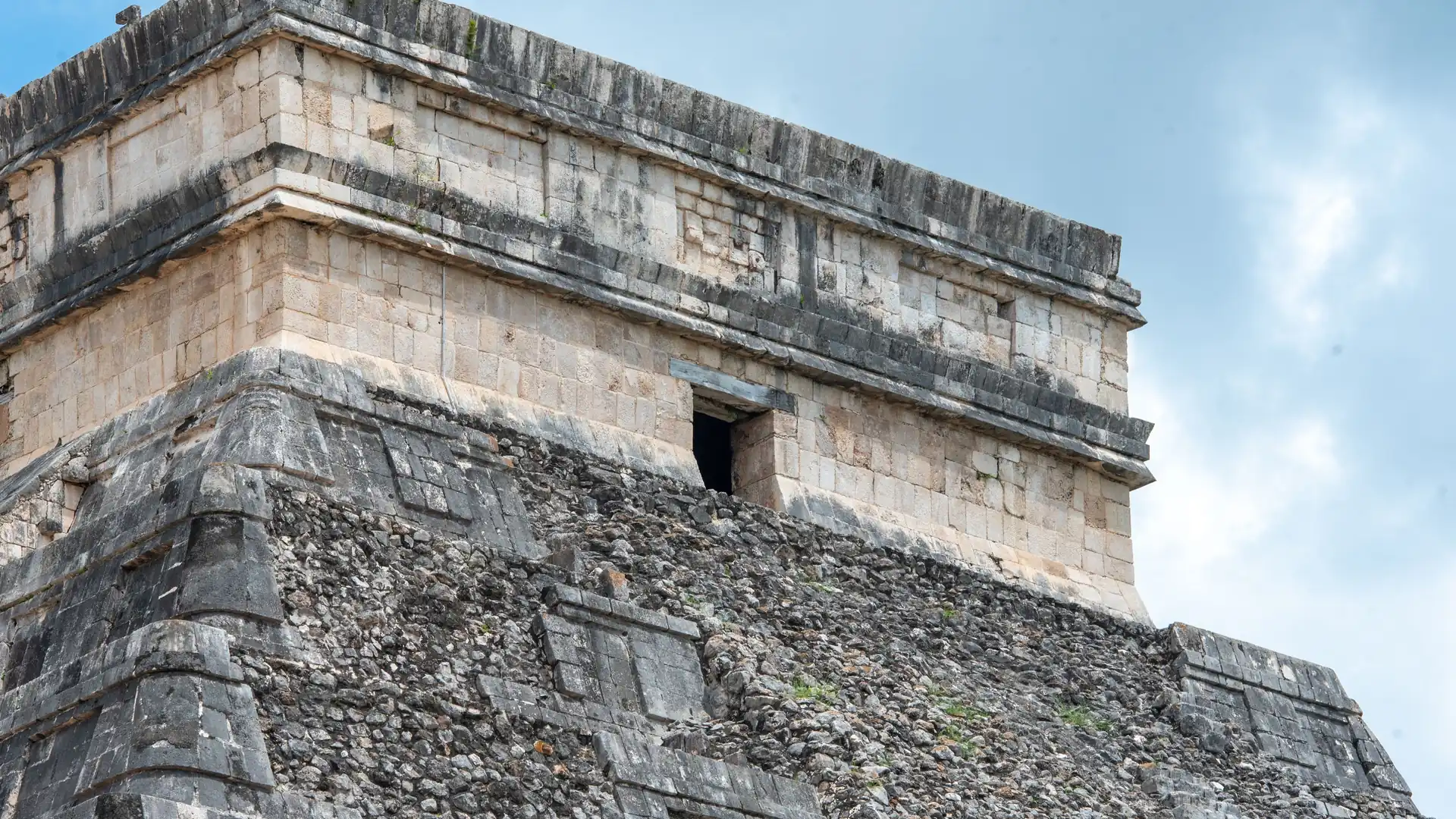 The weathered stone terraces of the pyramid at Chichén Itzá, Mexico