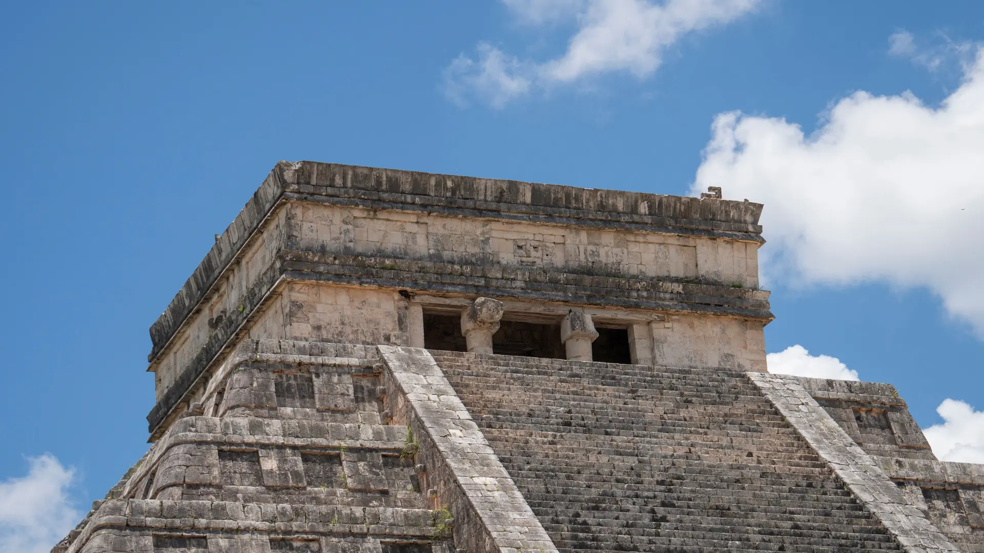 El Castillo, the pyramid at Chichén Itzá in Yucatán, against a blue sky