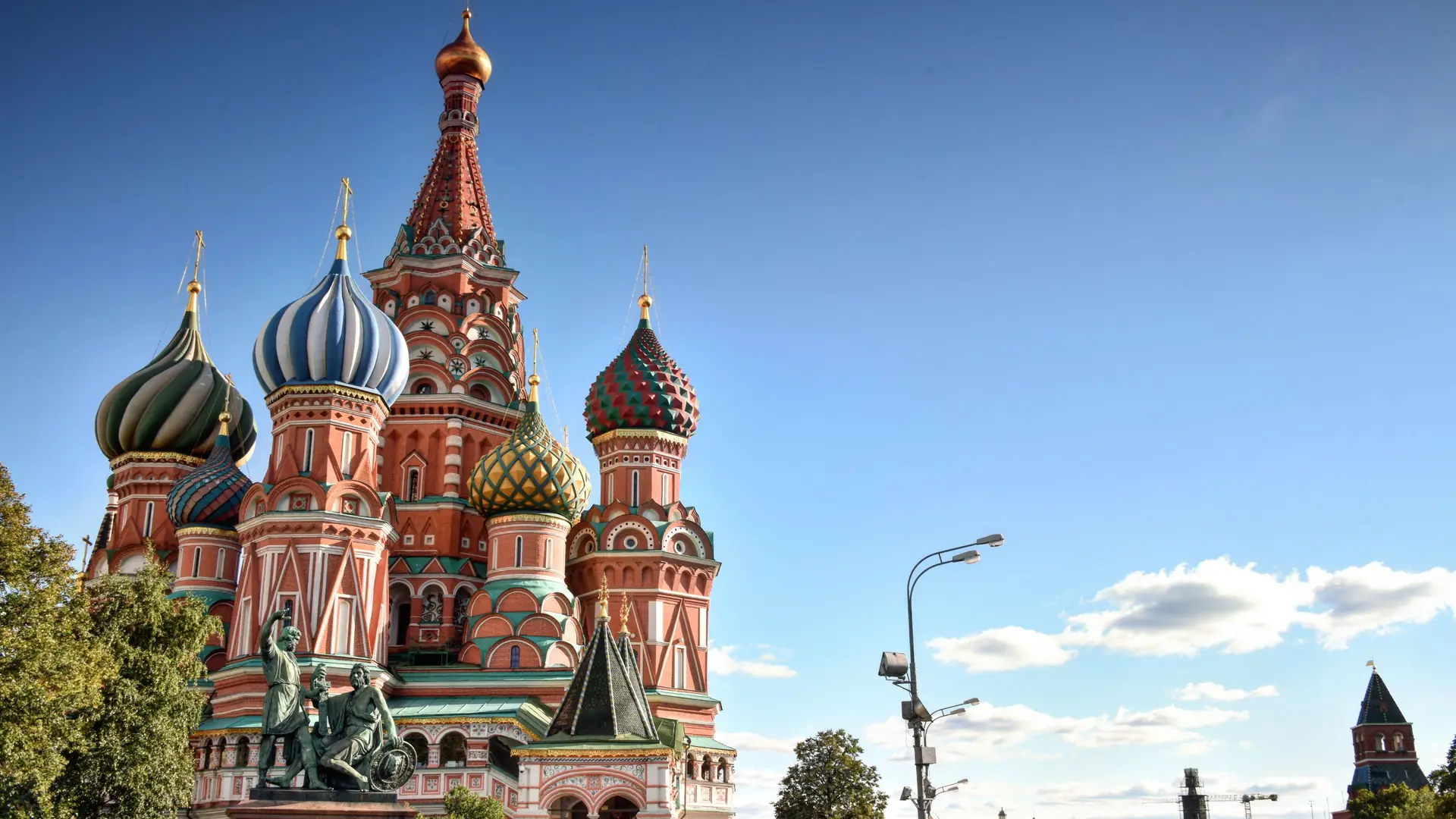St Basil’s Cathedral on Red Square in Moscow, seen past summer trees