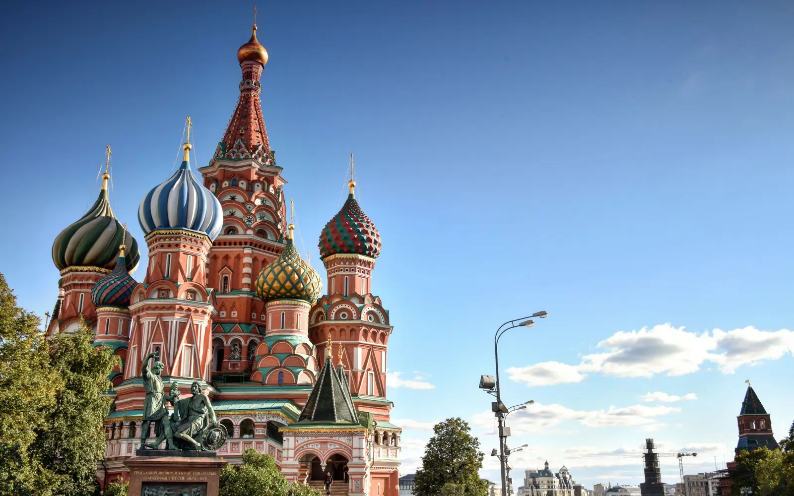 St Basil’s Cathedral on Red Square in Moscow, seen past summer trees